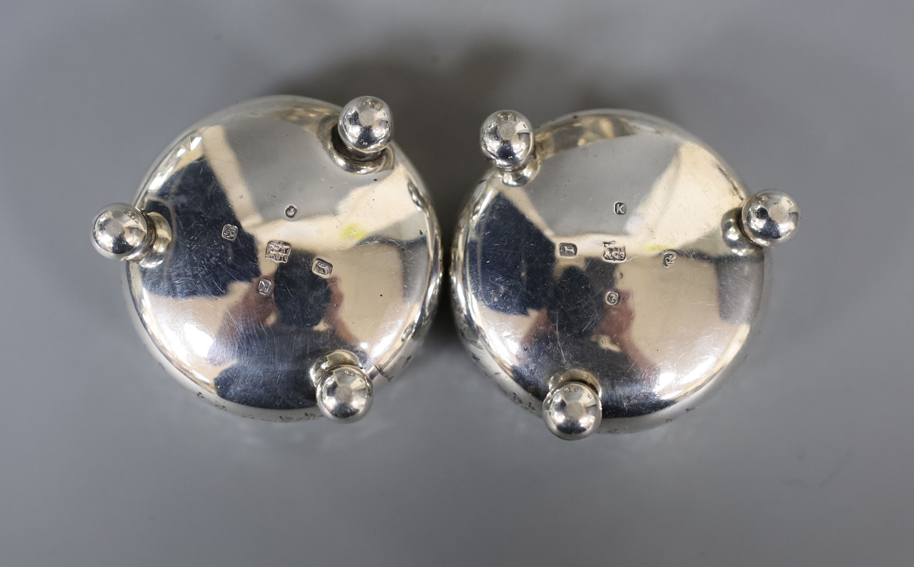 A silver sugar bowl, pair of silver bun salts and a silver mustard pot.